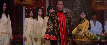 Movie still from “Enter the Dragon” (1973), directed by Robert Clouse – A group of young people dressed in asian clothing; Medium shot, Low angle