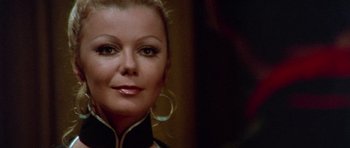 Movie still from “Enter the Dragon” (1973), directed by Robert Clouse – A woman's face in front of a mirror; Close Up shot, Over the shoulder angle