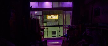 Movie still from “Enter the Void” (2009), directed by Gaspar Noé – A view of a building from a window; Wide shot, Low angle