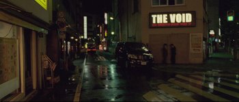 Movie still from “Enter the Void” (2009), directed by Gaspar Noé – Cars parked on the side of the street at night; Extreme Wide shot, Low angle