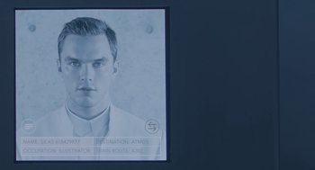 Movie still from “Equals” (2015), directed by Drake Doremus – A man in a white shirt and a white tie; Extreme Close Up shot, Overhead angle