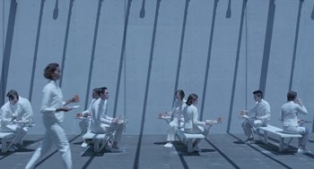 Movie still from “Equals” (2015), directed by Drake Doremus – A group of people sitting on top of a bench; Wide shot, High angle