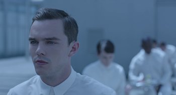Movie still from “Equals” (2015), directed by Drake Doremus – A man and a woman standing in front of another man; Close Up shot, Over the shoulder angle