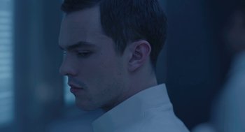 Movie still from “Equals” (2015), directed by Drake Doremus – A person wearing a white shirt; Close Up shot, Low angle