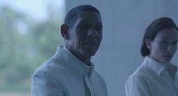 Movie still from “Equals” (2015), directed by Drake Doremus – A person wearing a white shirt and a tie; Close Up shot, Low angle