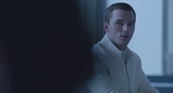 Movie still from “Equals” (2015), directed by Drake Doremus – A man in a white shirt is looking into a mirror; Close Up shot, Over the shoulder angle