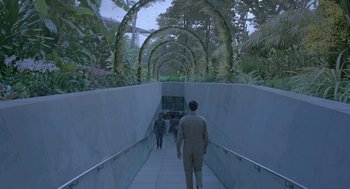 Movie still from “Equals” (2015), directed by Drake Doremus – A man in a suit walking down a ramp; Extreme Wide shot, High angle