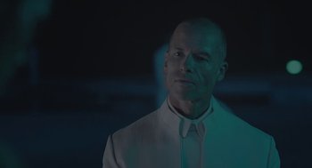 Movie still from “Equals” (2015), directed by Drake Doremus – A man wearing a white shirt and a white tie; Close Up shot, Low angle