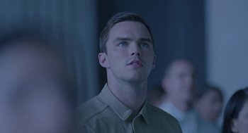 Movie still from “Equals” (2015), directed by Drake Doremus – A man with blue eyes looking up into the air; Close Up shot, Over the shoulder angle