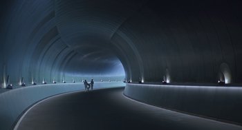 Movie still from “Equals” (2015), directed by Drake Doremus – Two people are standing in a tunnel with lights on; Extreme Wide shot, High angle