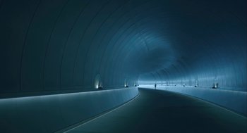 Movie still from “Equals” (2015), directed by Drake Doremus – A dark tunnel with people walking on the side of it; Extreme Wide shot, High angle