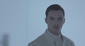 Movie still from “Equals” (2015), directed by Drake Doremus – A man in a white shirt and a white jacket; Close Up shot, Low angle