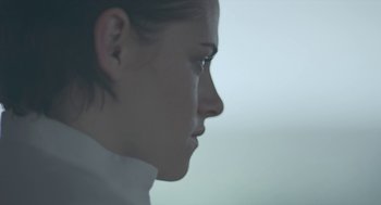 Movie still from “Equals” (2015), directed by Drake Doremus – A woman's face with a blurry background; Close Up shot, Over the shoulder angle