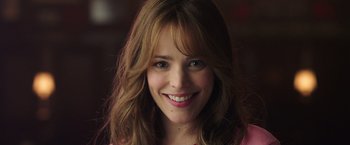 Movie still from “Game Night” (2018), directed by John Francis Daley – A person smiling for the camera; Close Up shot, Over the shoulder angle