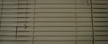 Movie still from “Game Night” (2018), directed by John Francis Daley – A window with blinds on it; Extreme Close Up shot, Overhead angle