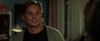 Movie still from “Game Night” (2018), directed by John Francis Daley – A person smiling for the camera; Close Up shot, Over the shoulder angle