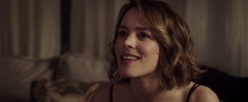 Movie still from “Game Night” (2018), directed by John Francis Daley – A person smiling; Close Up shot, Over the shoulder angle