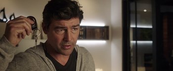 Movie still from “Game Night” (2018), directed by John Francis Daley – A person wearing a jacket; Close Up shot, Over the shoulder angle