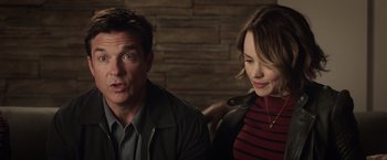 Movie still from “Game Night” (2018), directed by John Francis Daley – A man and a woman sitting next to each other; Close Up shot, Over the shoulder angle