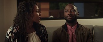 Movie still from “Game Night” (2018), directed by John Francis Daley – A man and a woman sitting next to each other; Close Up shot, Over the shoulder angle