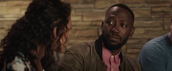 Movie still from “Game Night” (2018), directed by John Francis Daley – A man and a woman sitting at a table talking to each other; Close Up shot, Over the shoulder angle