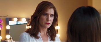 Movie still from “Girls Trip” (2017), directed by Malcolm D. Lee – A person looking at a mirror; Close Up shot, Over the shoulder angle