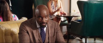 Movie still from “Girls Trip” (2017), directed by Malcolm D. Lee – A man and a woman sitting at a table in a restaurant; Medium shot, Over the shoulder angle