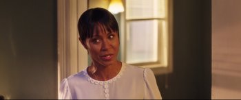 Movie still from “Girls Trip” (2017), directed by Malcolm D. Lee – A person wearing a white shirt; Close Up shot, Over the shoulder angle