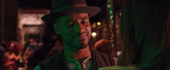 Movie still from “Girls Trip” (2017), directed by Malcolm D. Lee – A person wearing a hat; Close Up shot, Over the shoulder angle