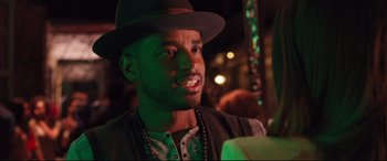 Movie still from “Girls Trip” (2017), directed by Malcolm D. Lee – A person wearing a hat; Close Up shot, Over the shoulder angle