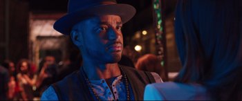 Movie still from “Girls Trip” (2017), directed by Malcolm D. Lee – A person wearing a hat; Close Up shot, Over the shoulder angle