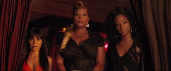 Movie still from “Girls Trip” (2017), directed by Malcolm D. Lee – A woman in a black dress with a long blonde ponytail; Close Up shot, Low angle