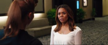 Movie still from “Girls Trip” (2017), directed by Malcolm D. Lee – A woman in a white shirt looking at a man; Close Up shot, Over the shoulder angle