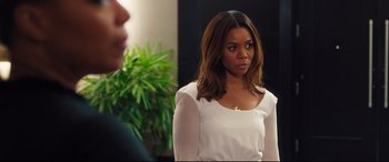 Movie still from “Girls Trip” (2017), directed by Malcolm D. Lee – A woman standing in front of a mirror; Close Up shot, Over the shoulder angle
