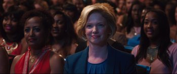 Movie still from “Girls Trip” (2017), directed by Malcolm D. Lee – A person wearing a suit; Close Up shot, Over the shoulder angle