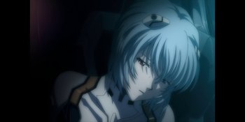 Movie still from “Evangelion: 3.0+1.01 Thrice Upon a Time” (2021), directed by Joe Fria – A person with a blue wig; Close Up shot, Low angle