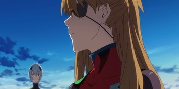Movie still from “Evangelion: 3.0+1.01 Thrice Upon a Time” (2021), directed by Joe Fria – A person with long blonde hair; Close Up shot, Low angle