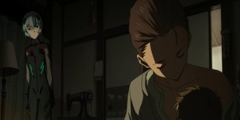 Movie still from “Evangelion: 3.0+1.01 Thrice Upon a Time” (2021), directed by Joe Fria – A person sitting in front of a sewing machine in a dark room; Medium shot, Over the shoulder angle