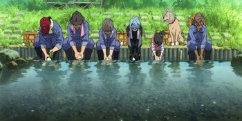 Movie still from “Evangelion: 3.0+1.01 Thrice Upon a Time” (2021), directed by Joe Fria – A group of people standing next to a body of water; Wide shot, High angle