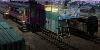 Movie still from “Evangelion: 3.0+1.01 Thrice Upon a Time” (2021), directed by Joe Fria – A train on a train track near a train station; Extreme Wide shot, High angle