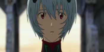 Movie still from “Evangelion: 3.0+1.01 Thrice Upon a Time” (2021), directed by Joe Fria – A person with short blue hair; Close Up shot, Low angle