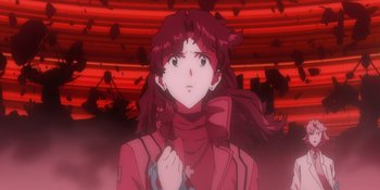 Movie still from “Evangelion: 3.0+1.01 Thrice Upon a Time” (2021), directed by Joe Fria – A person with long red hair; Close Up shot, Low angle
