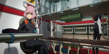 Movie still from “Evangelion: 3.0+1.01 Thrice Upon a Time” (2021), directed by Joe Fria – An anime girl sitting in a room with a lot of wires; Wide shot, Low angle