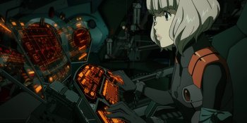 Movie still from “Evangelion: 3.0+1.01 Thrice Upon a Time” (2021), directed by Joe Fria – An animated scene of a woman looking at a computer screen; Medium shot, Low angle
