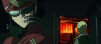 Movie still from “Evangelion: 3.0 You Can (Not) Redo” (2012), directed by Kiyotaka Suzuki – A man's face in front of a computer screen; Close Up shot, Low angle