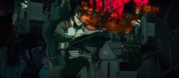 Movie still from “Evangelion: 3.0 You Can (Not) Redo” (2012), directed by Kiyotaka Suzuki – A man sitting at a desk in a room; Medium shot, High angle