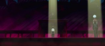 Movie still from “Evangelion: 3.0 You Can (Not) Redo” (2012), directed by Kiyotaka Suzuki – A man standing in front of a stage with light coming out of it; Extreme Wide shot, Low angle