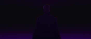 Movie still from “Evangelion: 3.0 You Can (Not) Redo” (2012), directed by Kiyotaka Suzuki – A man standing in the dark in front of a black background; Wide shot, Low angle