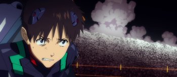Movie still from “Evangelion: 3.0 You Can (Not) Redo” (2012), directed by Kiyotaka Suzuki – A person with a bomb in the background; Close Up shot, Low angle