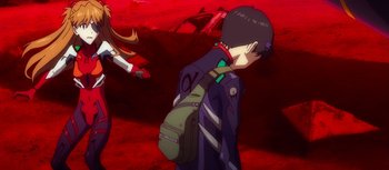 Movie still from “Evangelion: 3.0 You Can (Not) Redo” (2012), directed by Kiyotaka Suzuki – A person with a backpack walking in a field; Medium shot, Over the shoulder angle